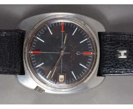 A gentleman's Bulova Accutron stainless steel cased wristwatch with black enamel dial and baton numerals, on black leather Hi