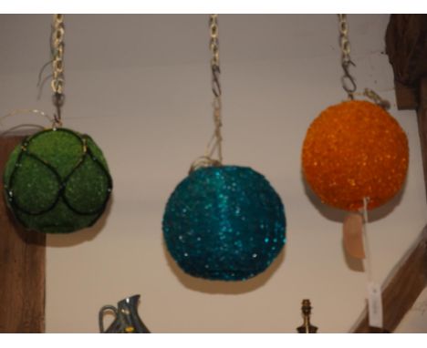 A 1970s green resin globular light fitting, a similar turquoise light fitting and a similar orange light fitting, each 12" hi