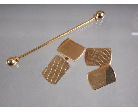 A pair of 9ct gold engine turned cufflinks, 6g, and a cravat pin 