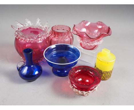 A ruby glass and lamp work shallow bowl, two similar pieces of glass, a Venetian style blue and white glass shallow footed bo