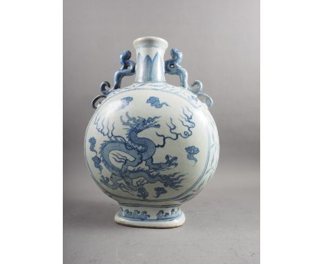 A Chinese blue and white porcelain dragon handled and decorated moon flask, 16 3/4" high 