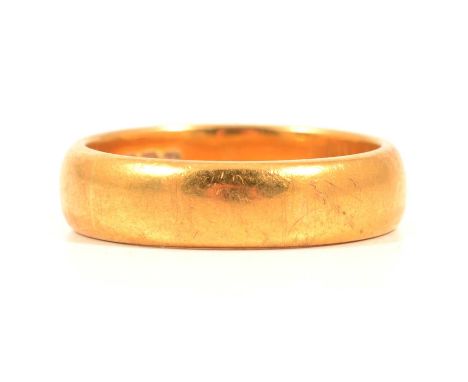 A 22 carat yellow gold wedding band, 5.4mm wide plain polished D shape ring size Q, Birmingham 1945, 9g.