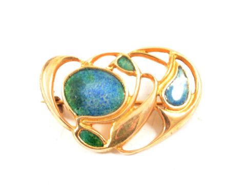 Archibald Knox for Liberty &amp; Co - an Art Nouveau enamel brooch, the 30mm yellow metal brooch decorated with blue/green en