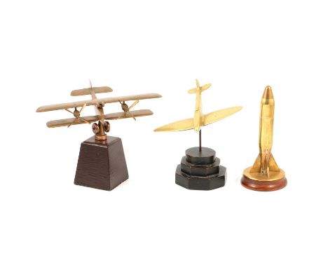 Trench art shell case cigarette lighter and two models of aeroplanes in brass, a trench art shell case cigarette lighter, on 