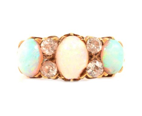 A Victorian opal and diamond half hoop ring, the three oval cabochon cut opals spaced by two pairs of old cut diamonds in an 