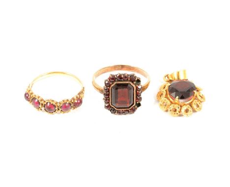 Two garnet dress rings and a pendant, a garnet cluster dress ring, the approx. 9.7 x 8mm rectangular step cut garnet bezel se