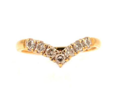 A diamond wishbone ring, the seven brilliant cut stones claw set in an 18 carat all yellow gold wishbone design mount ring si