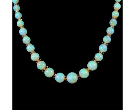 An opal bead necklace, the opals graduating from 4.7 to 12.5mm and spaced by faceted crystal rondels, into a single row 44cm 