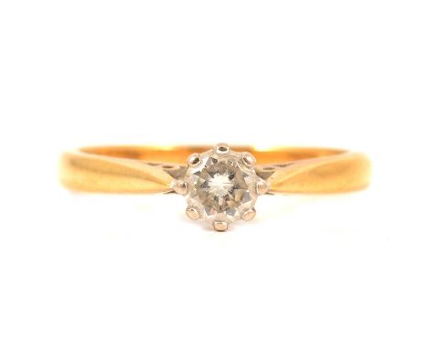 A diamond solitaire ring, the brilliant cut stone claw set in an 18 carat yellow and white gold mount ring size Q, .36 stampe