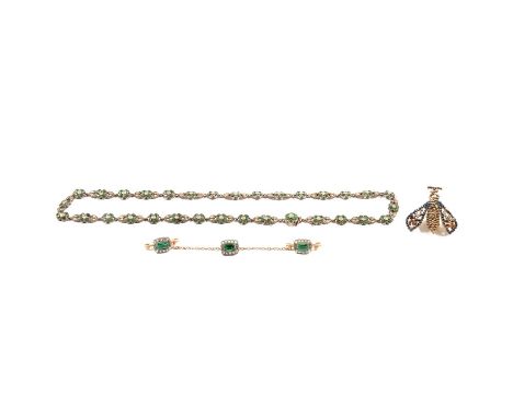 A white metal necklace set with green paste and marcasite in 6.5mm floral clusters, closed back settings, one cluster incorpo