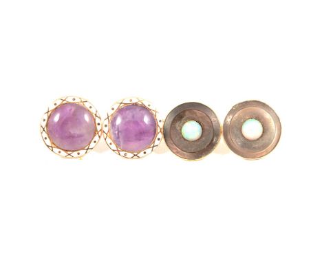 A pair of circular amethyst earrings with a white enamel border, closed back setting marked 9ct, 15mm diameter; another pair 