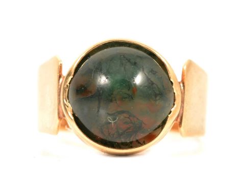 A bloodstone signet ring, 9mm round cabochon cut stone, collet set in a closed back setting, 9 carat yellow gold plain wide b