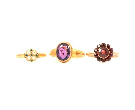 Three gemset rings, amethyst, garnet and pearl, the oval mixed cut amethyst 9 x 7mm, collet set in an all yellow metal mount 