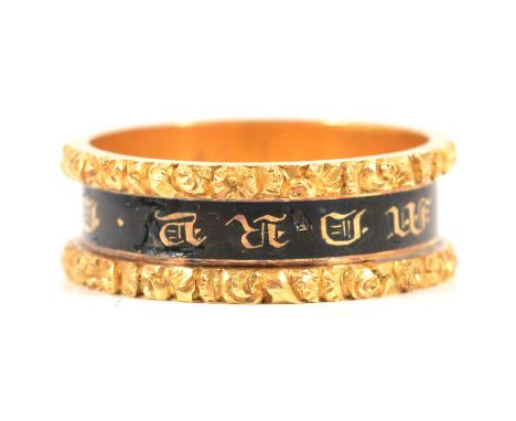 A George IV mourning ring, a 7.6mm wide 18 carat yellow gold band with recessed black enamel centre with lettering "In memory