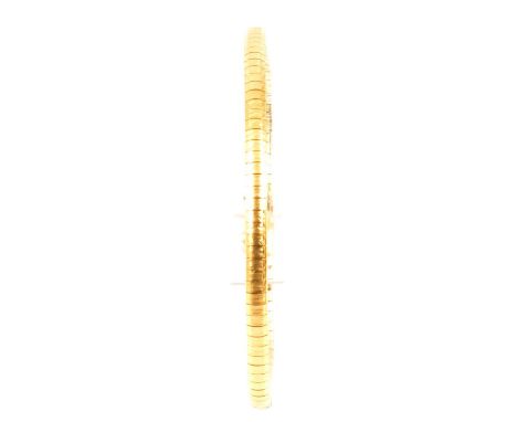 A yellow metal articulated bracelet, part plain polished and part engine turned design, tongue snap fastener with safety catc
