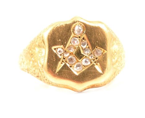 A diamond set 18 carat yellow gold Masonic ring, the Masonic emblem to the shield shape head set with twelve old and rose cut