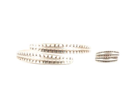 A David Andersen silver ‘Saga’ bangle and ring, the bangle 70mm internal diameter, the ring size R1/2, total weight 1.35ozt.Q