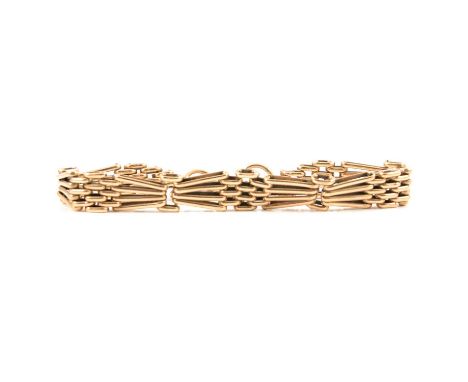 A 9 carat gold gate link bracelet, the four bar links are arranged in a bow design and fitted with a padlock fastener and saf