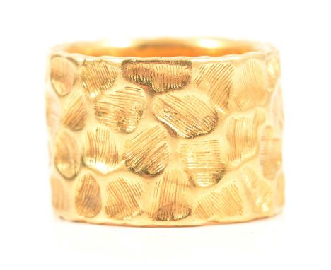 Kutchinsky - an 18 carat yellow gold 13.7mm wide band, honey comb design with textured recesses, London 1967 and also bearing