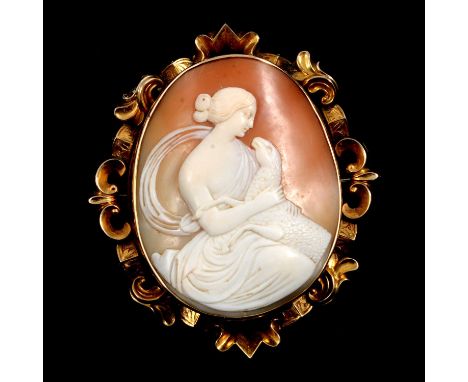 A cameo brooch, the oval carved shell cameo, 55x 45mm, female with sheep, set in a yellow metal mount testing as gold with sc