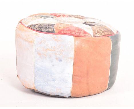 A vintage mid century Moroccan style leather panelled pouffe footrest. The foot stool featuring bright coloured panelled side