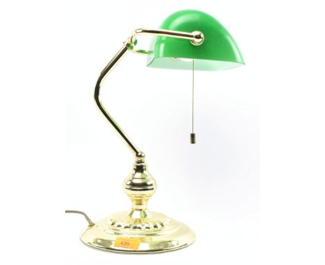 A vintage 20th century gilt metal &amp; glass Bankers desk table lamp light. The lamp having a half-dome shaped green glass s