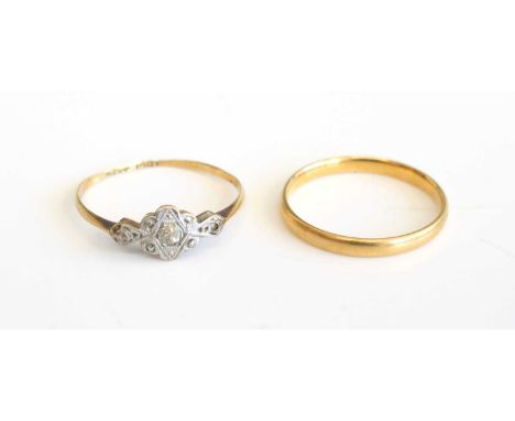 A 22ct gold wedding band, sponsor SH, size M, 1.7g, together with an 18ct gold and platinum diamond three stone ring, circa 1