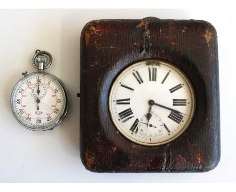 A nickel case Goliath pocket watch having white enamel Roman dial, keyless movement, 7.7cm, and in leather travel case, toget