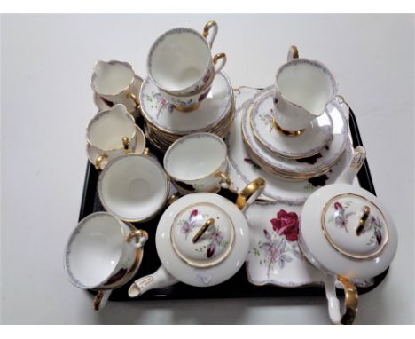 A tray of thirty six pieces of Royal Stafford Roses to Remember bone tea china 