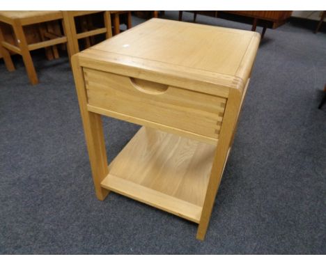A contemporary two tier lamp table, fitted a drawer. 
