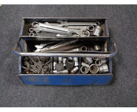 A metal concertina tool box containing socket sets and spanners 