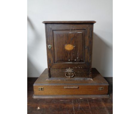 An Edwardian smoker's cabinet together with an oak cutlery canteen and a pipe rack in the form of a gate.  