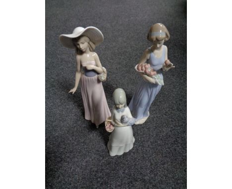 Two Nao figures of ladies, together with one further Spanish figure.  