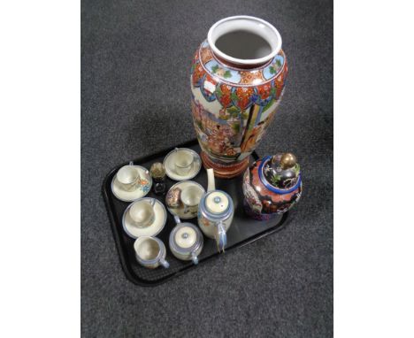 A tray of oriental wares including lidded vases, pair of decorative eggs on wooden stand, part egg shell tea service 