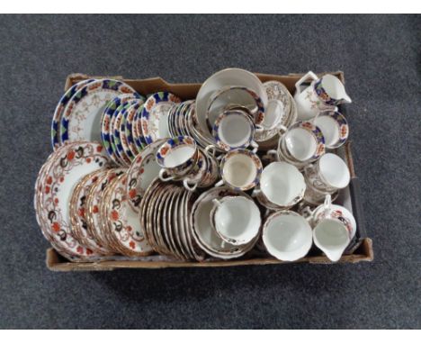 A box of two antique china tea services and a teapot 