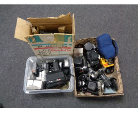 Two boxes containing assorted vintage and digital cameras to include Zenit, Pentax, Chinon, accessories, together with a boxe