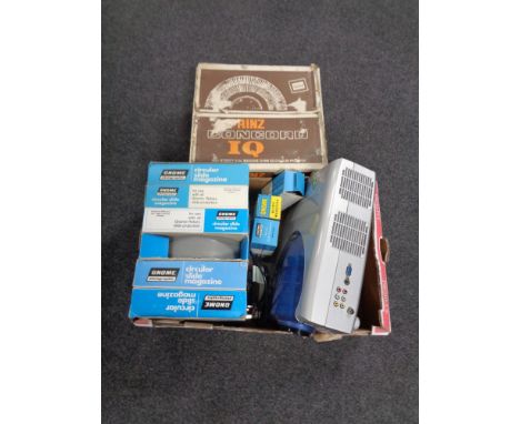 A boxed Prinz Concord projector together with a further box containing Gnome slide magazines and a Ally digital projector. 