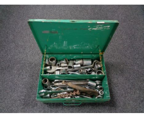 A metal tool box of assorted spanners, socket sets etc 