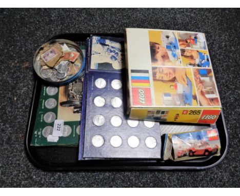 A tray of two boxed Lego sets number 265 and 606, Shell Man in flight and historic cars coin sets, loose stamps and further s