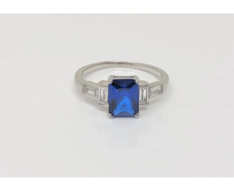 An Art Deco style sterling silver ring set with a blue stone, size N