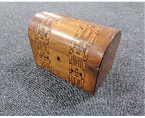 A Victorian marquetry inlaid domed topped tea caddy  