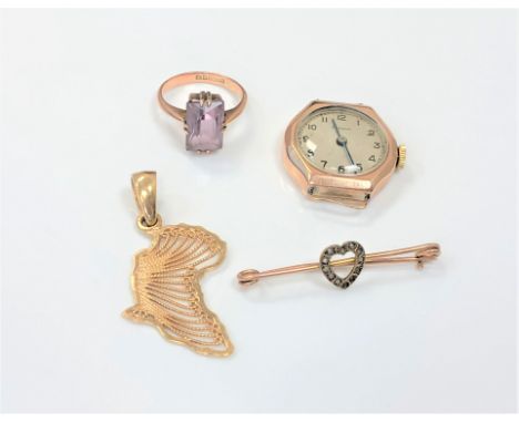 A 9ct gold cased Pinnacle lady's watch face, a 9ct gold amethyst ring, a pendant and a bar brooch with indistinct marks. (4)