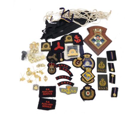 Collection of Navy insignias, buttons and badges, including cap tallies for H.M.S Raleigh and H.M.S Chevron, Officers cap bad