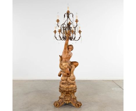 A wood-sculptured floor lamp with a blackamoor, Italy, circa 1920.&nbsp;Dimensions:(H:194 x D:57 cm)