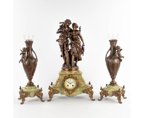 A three-piece mantle garniture clock with side pieces, spelter on an onyx base.Statue by Auguste Moreau, 'La Rencontre'. Mark