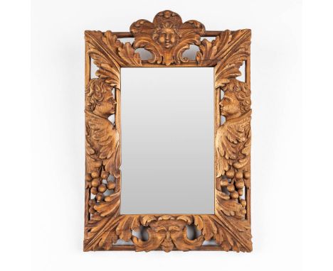 A mirror with wood-sculptured angels and mythological figurines. First half of the 20th century.&nbsp;Dimensions:(W:34 x H:49