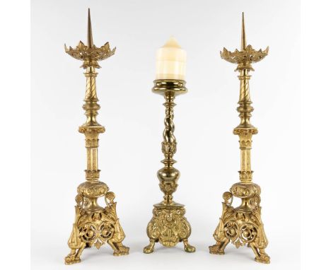 A pair of antique bronze Chruch Candlesticks, and added a candlestick. Circa 1900.Decorated with mythological figurines and a