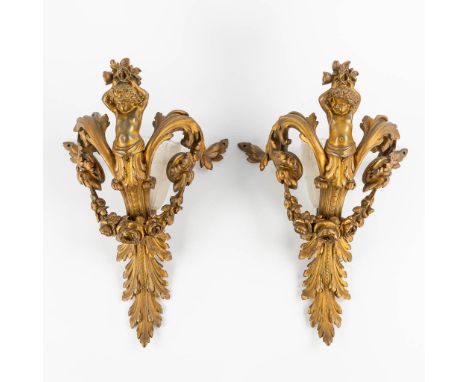 A pair of gilt bronze wall lamps, decorated with putti.&nbsp;Louis XV style.The second half of the 19th century.&nbsp;Dimensi