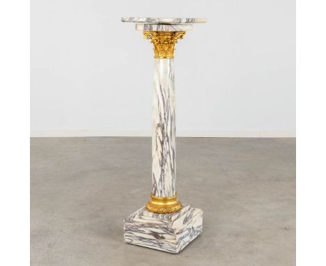 A Pedestal, marble mounted with gilt bronze, Corinthian.Revolving plateau on the top.&nbsp;19th century.&nbsp;Dimensions:(D:3
