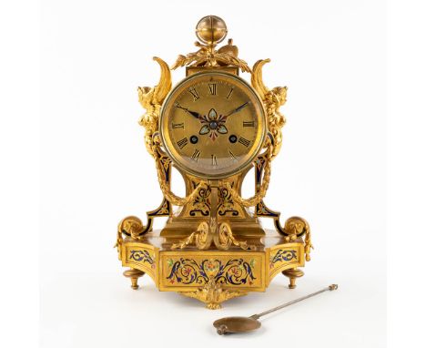 A small mantle clock, bronze decorated with enamel, angels and a globe. 19th C.&nbsp;Dimensions:(D:12,5 x W:20 x H:28 cm)